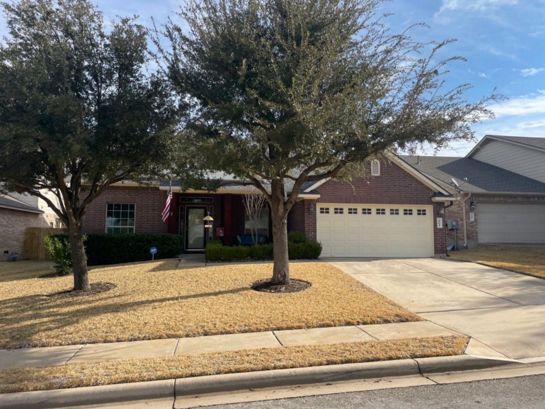 magnolia creek one story red brick home in leander texas