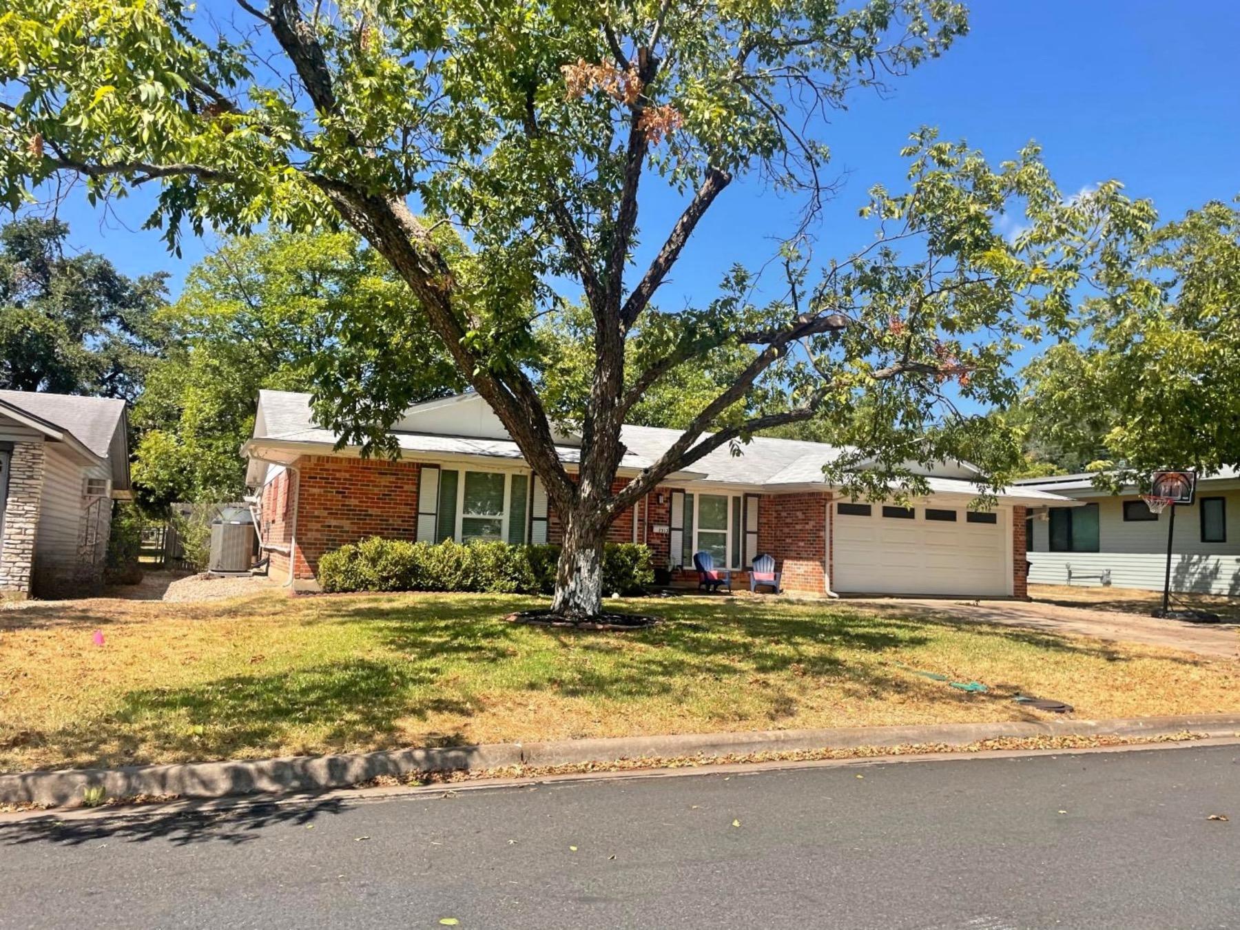 southern oaks 1 story red brick home Austin tx 78745