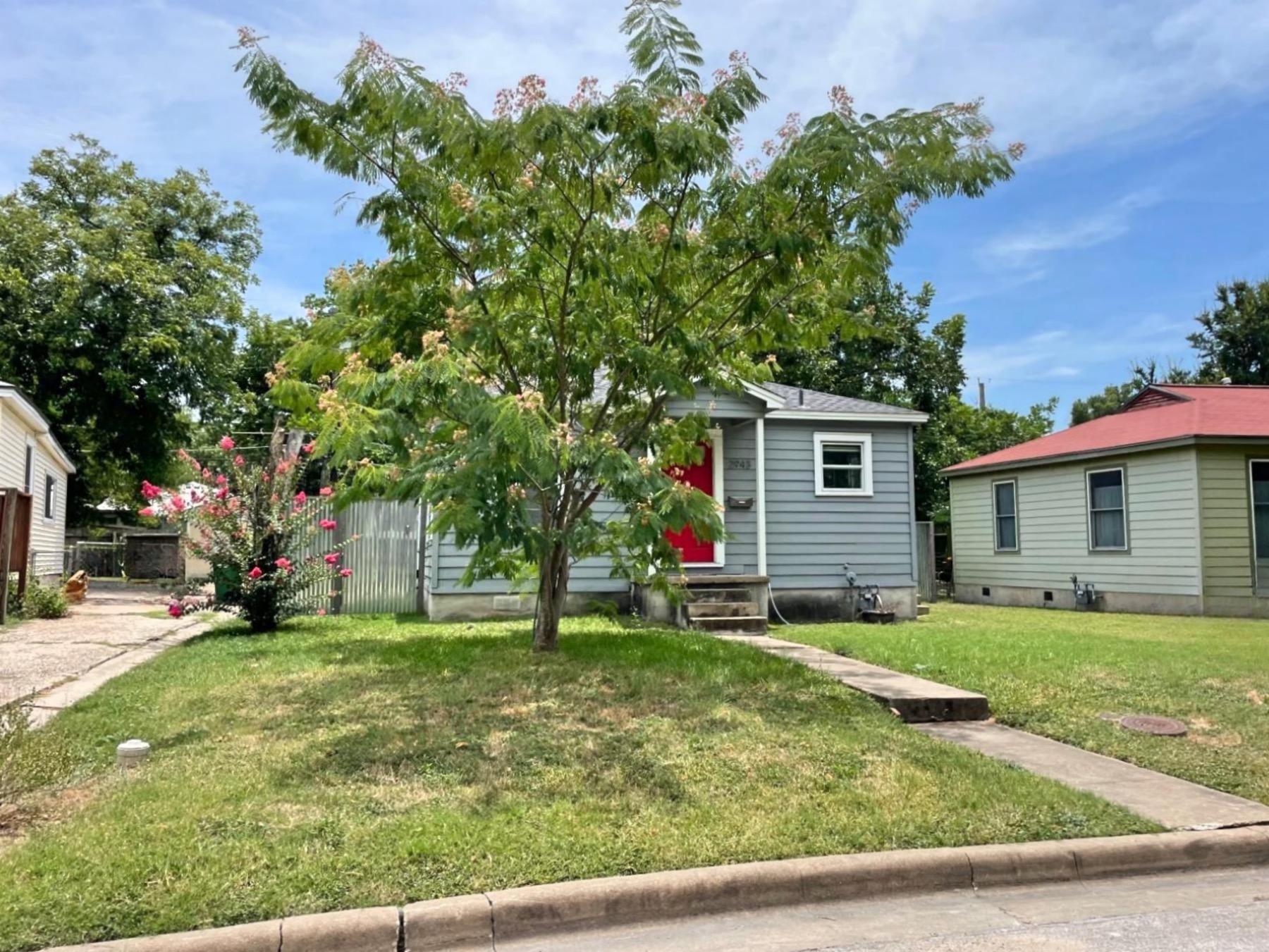 Austin heights home with red door 78722