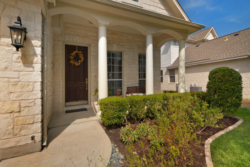 tips for women home buyers trimmed plants entrance