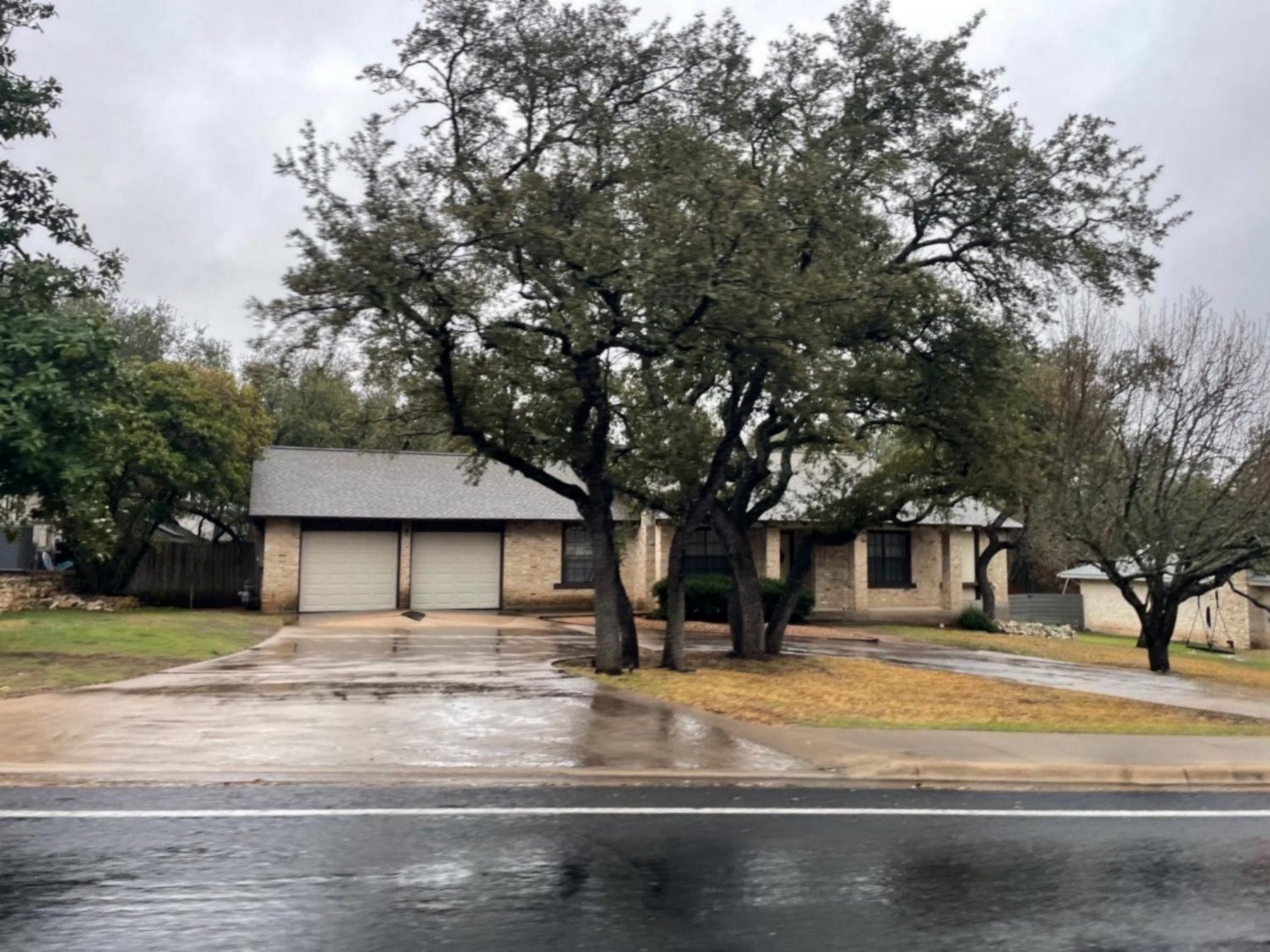 lost creek one story stone home in Austin 78746