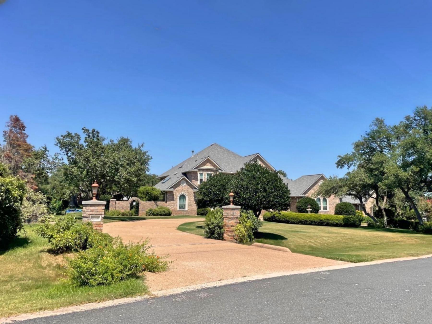 post oak estates brick home circle driveway leander