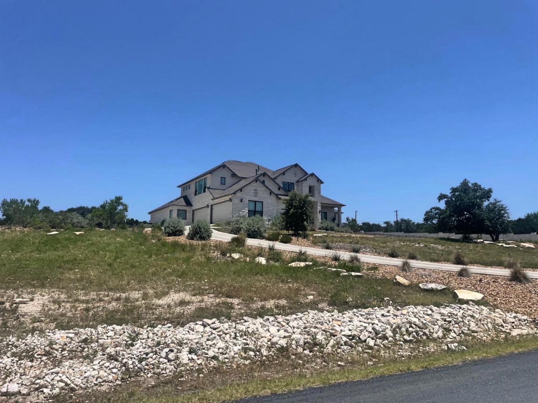 bluffs of sandy creek leander home above street