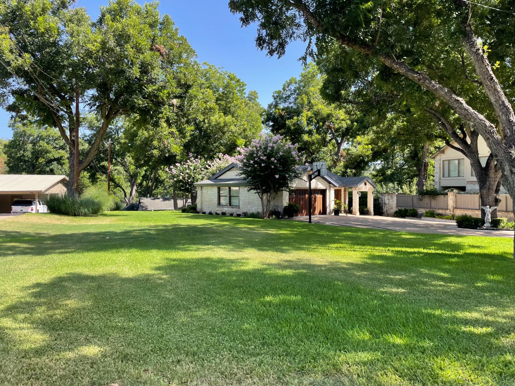 panorama ranch home with mature tree Austin 78733