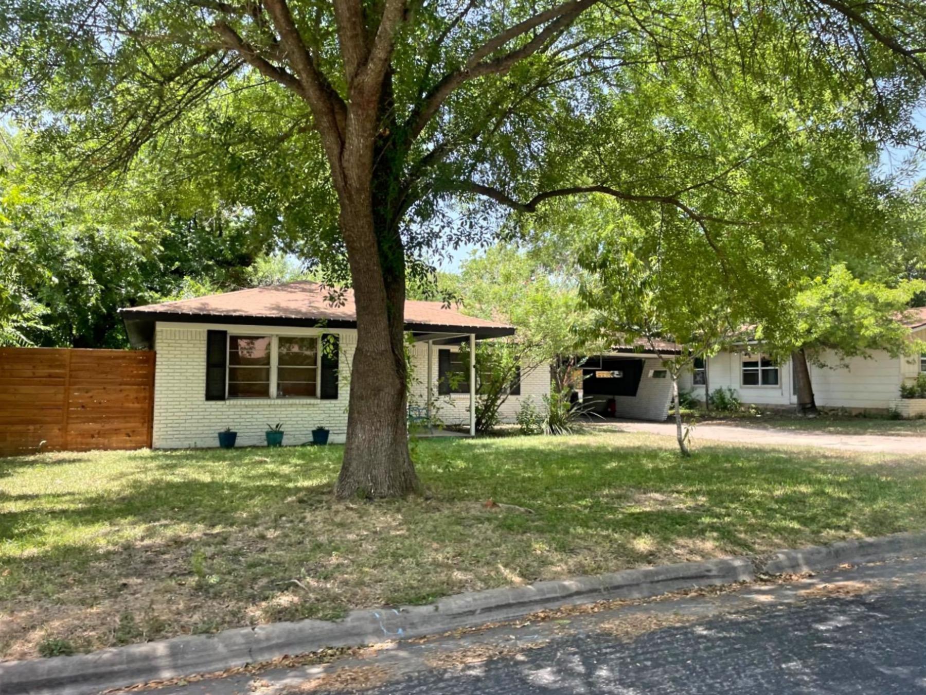 university hills Austin white brick home