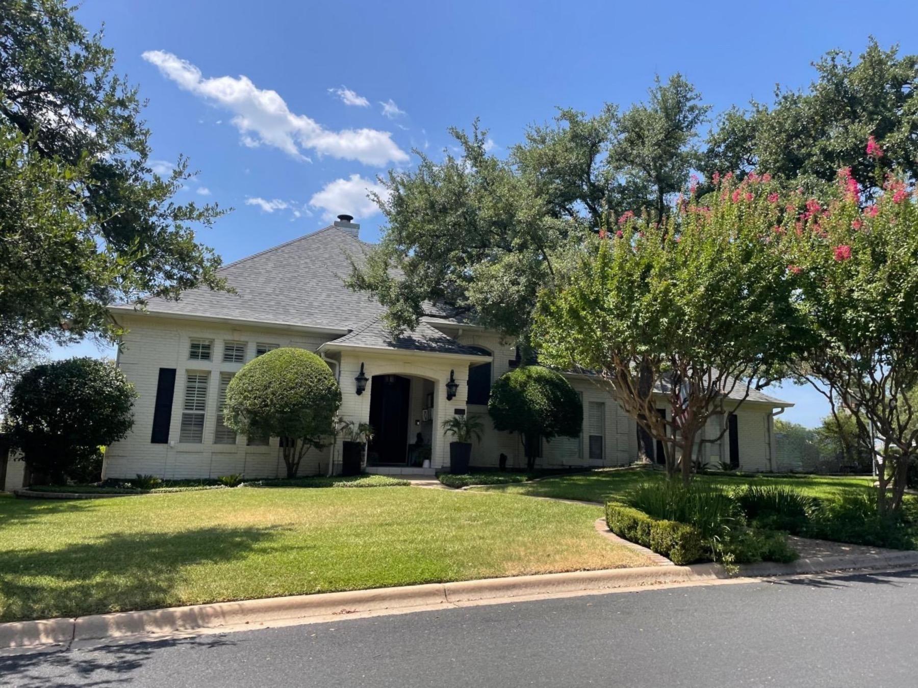 Davenport ranch one story white brick home Austin tx