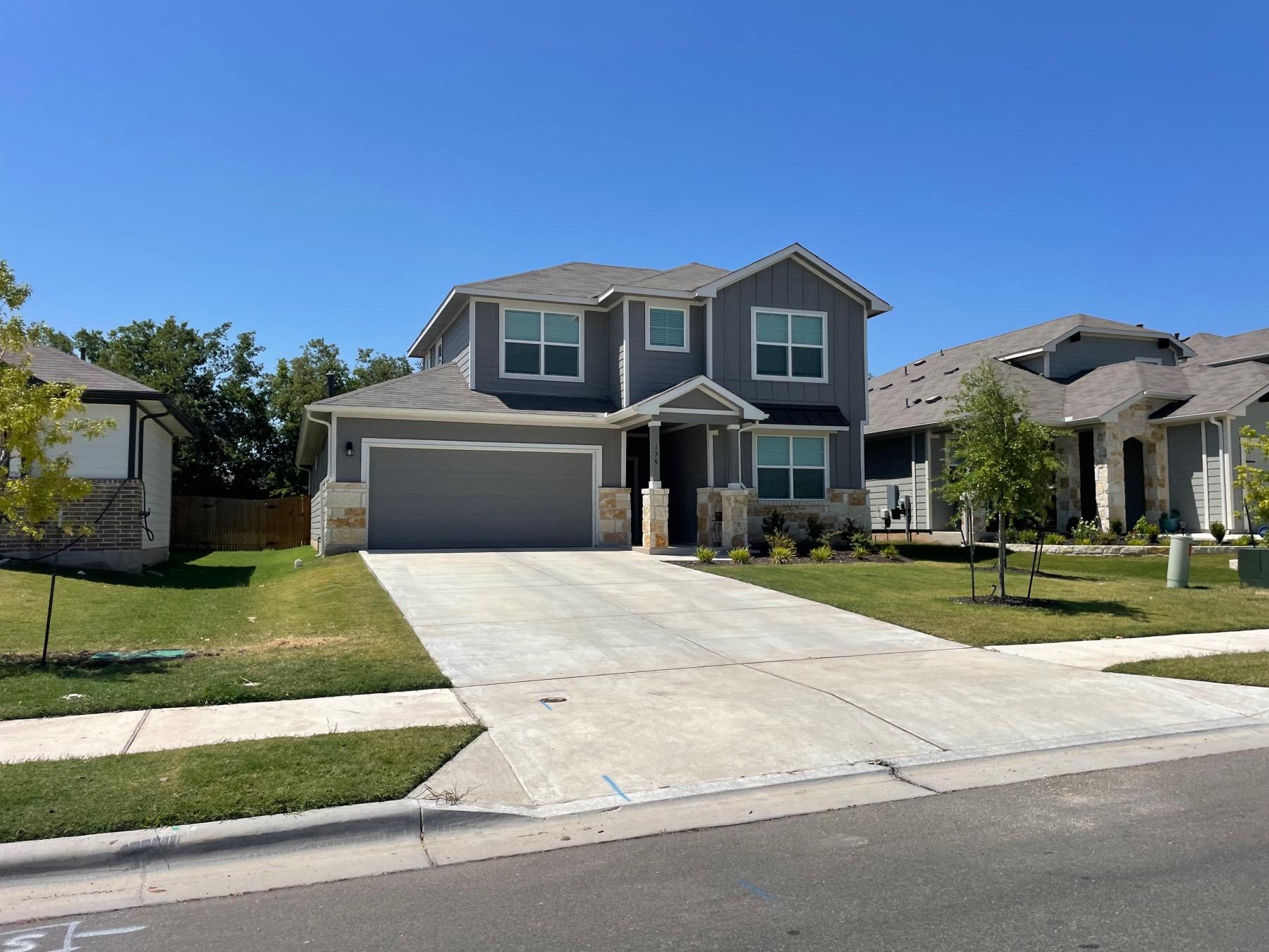 mustang creek two story grey home in hutto tx