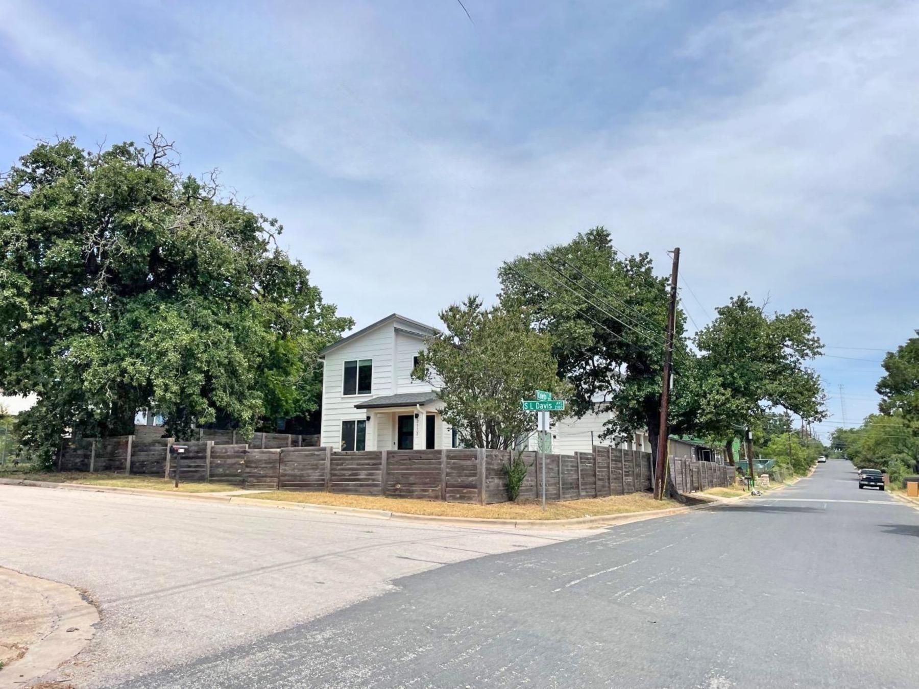 rosewood home on corner lot Austin 78702