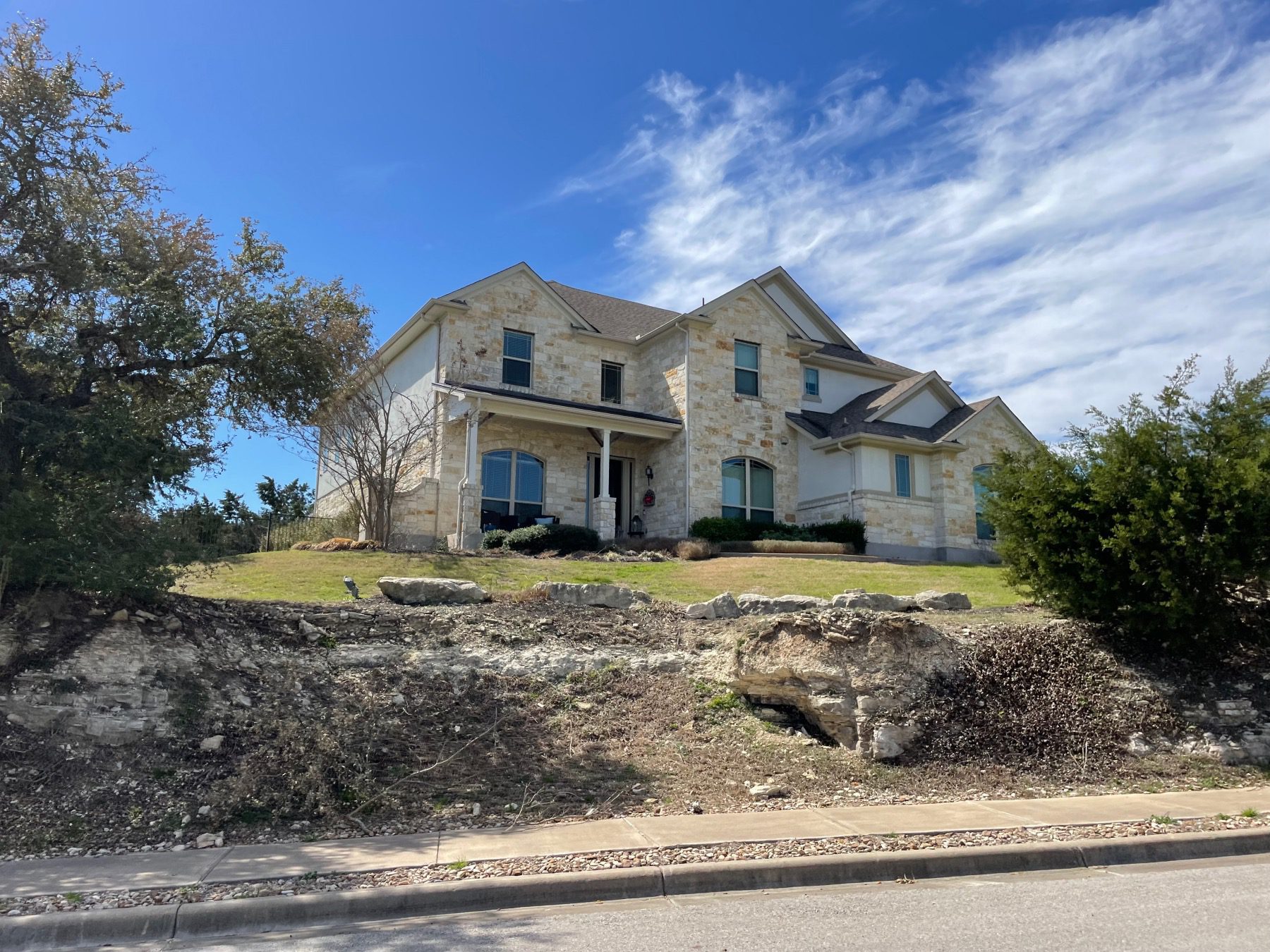 cedar ridge estates home above street in Austin tx 78737