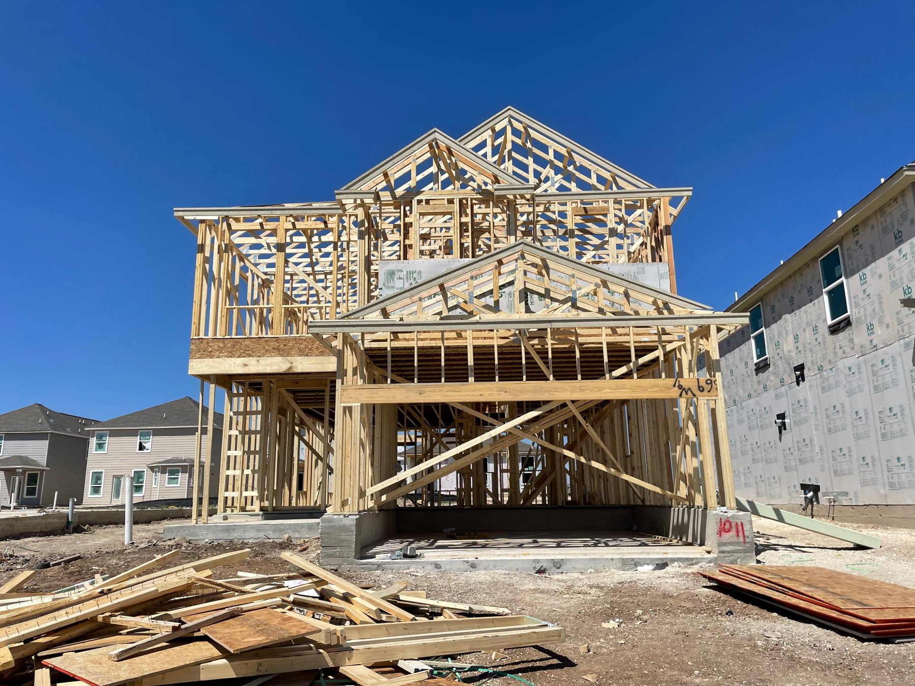 New construction home under framing in Berry Springs, a Georgetown Texas master planned community