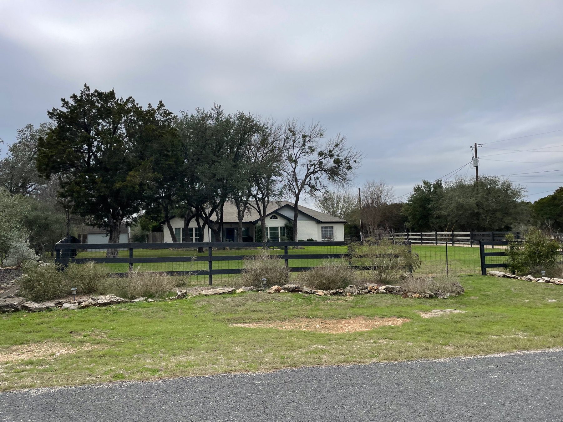 twin springs home behind fence