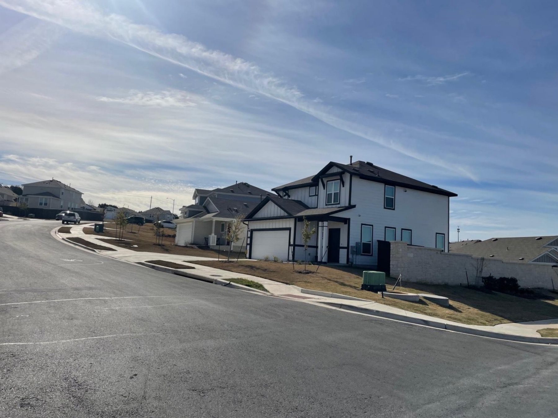 cloverleaf homes on sloped street Austin 78747