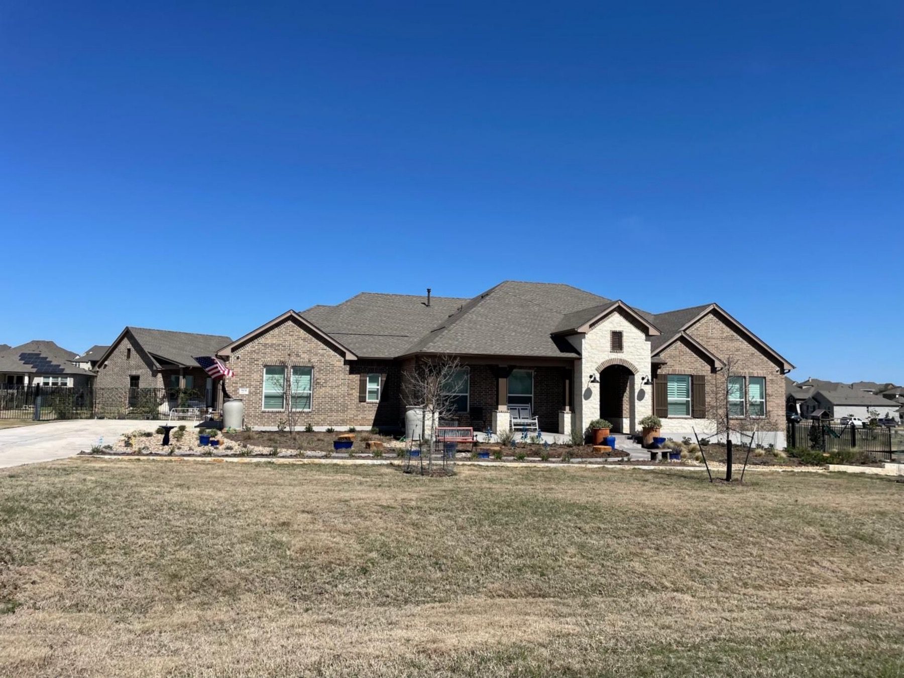 estates of sawyer ranch home with side entry garage Austin