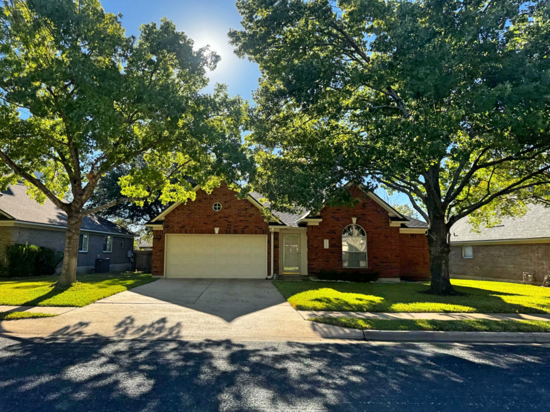 Cat Hollow one story red brick home Round Rock