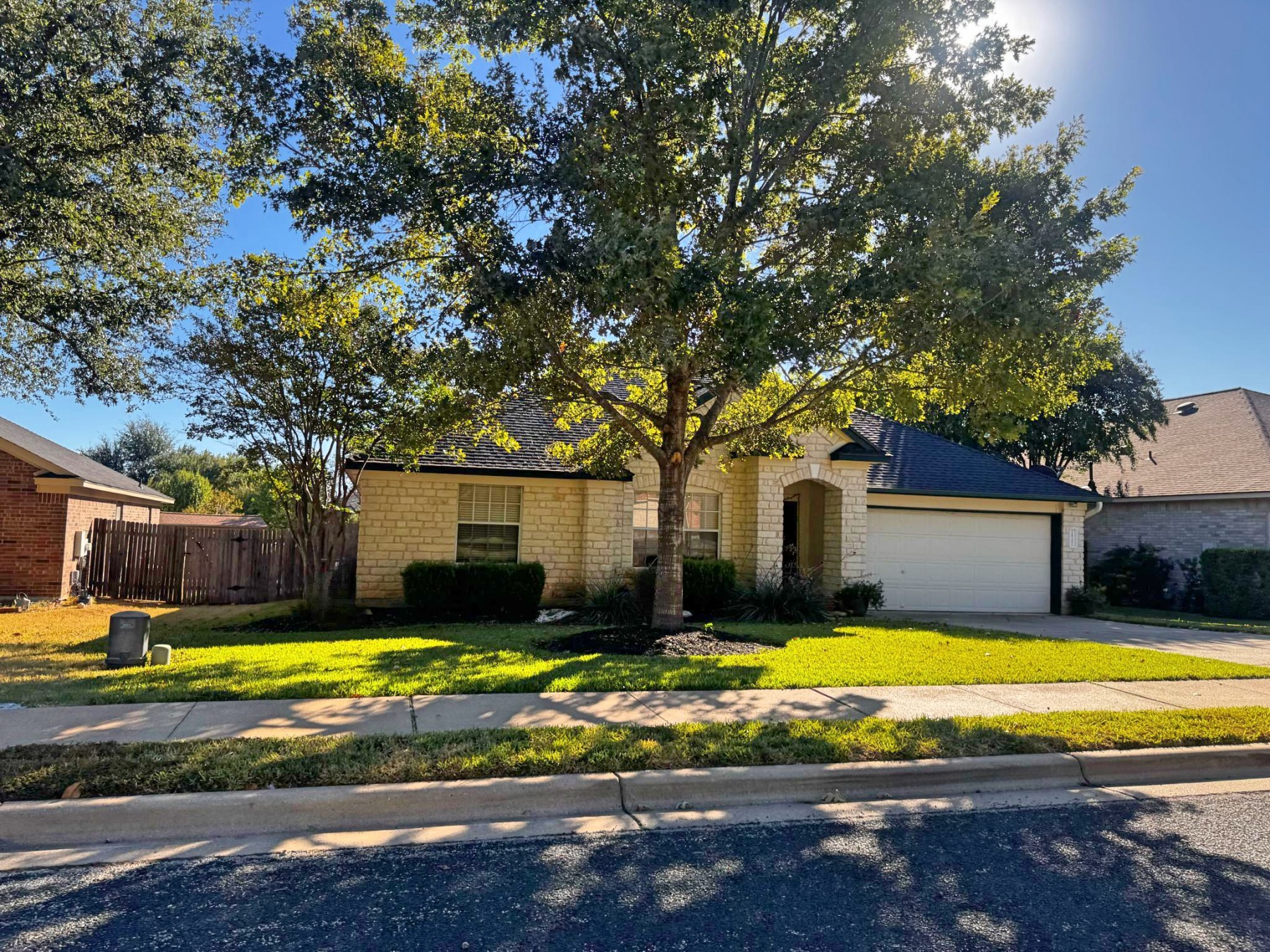 Cat Hollow one story white stone home Round Rock