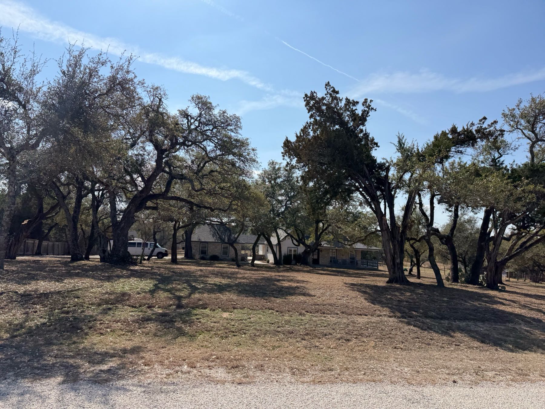 Home on wooded acreage lot with mature oak trees in Sunset Canyon, Dripping Springs TX 78620