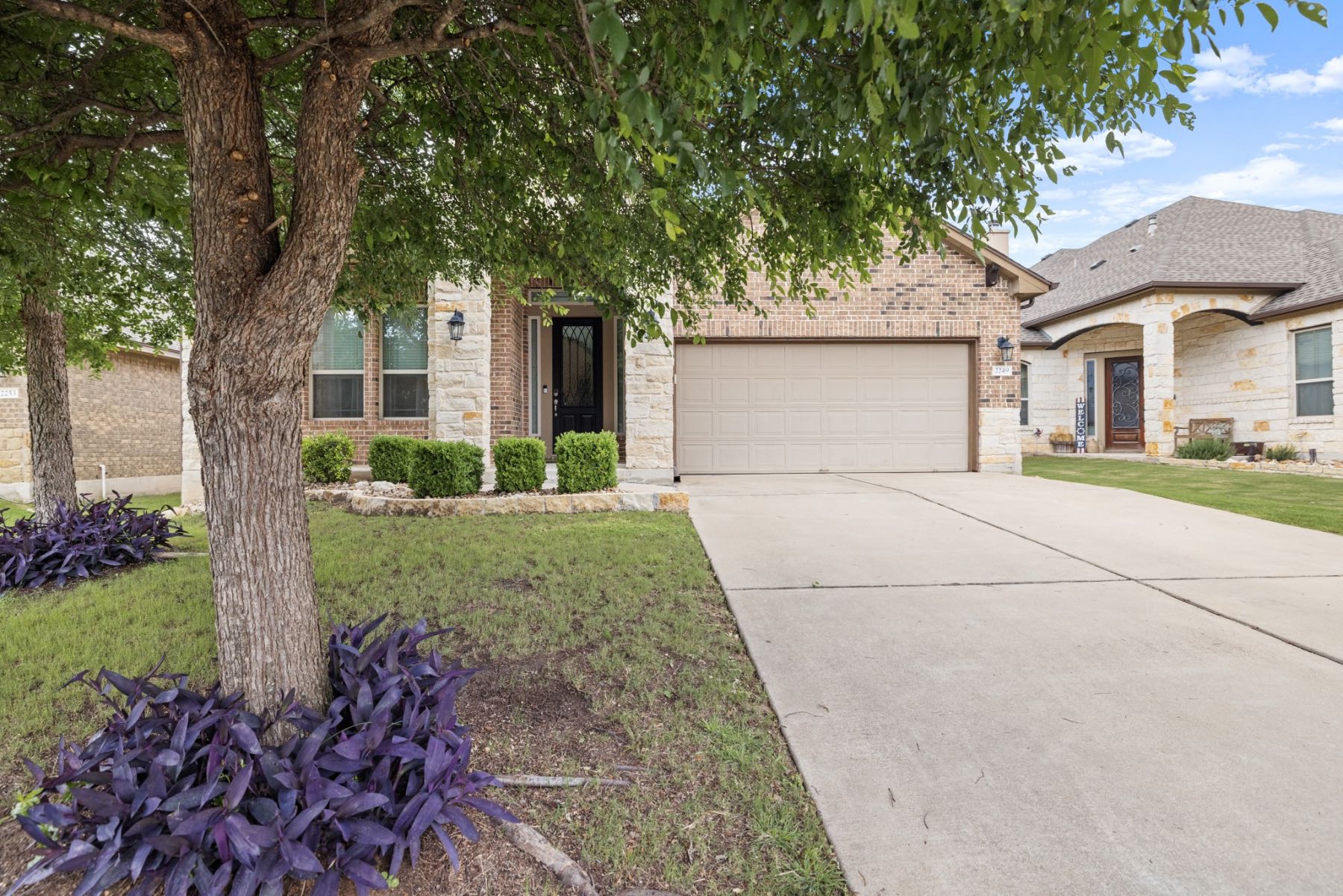 Brick and stone exterior of a single family home in the Austin Texas suburbs