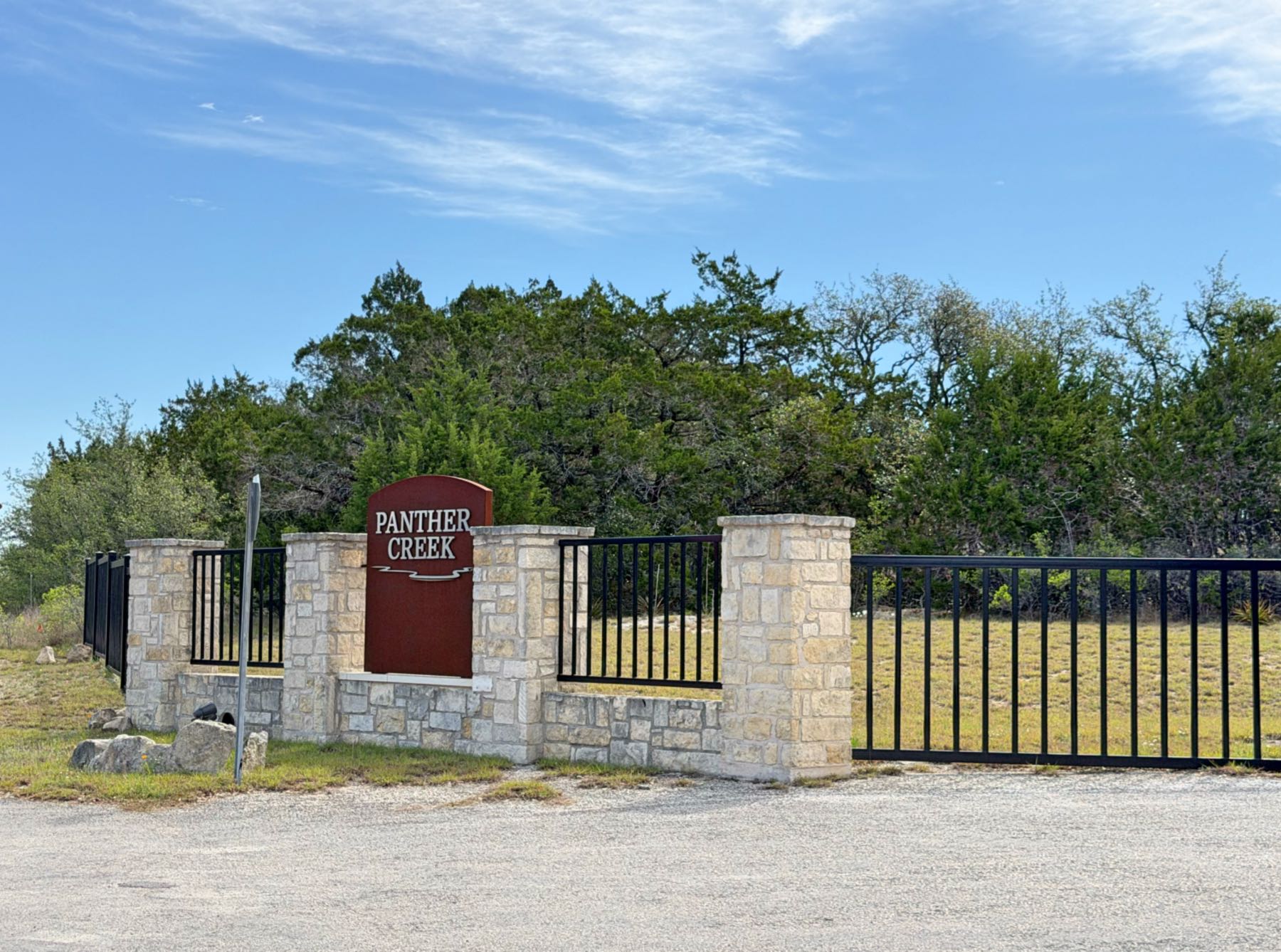 Panther Creek neighborhood entrance gate and sign in Driftwood TX