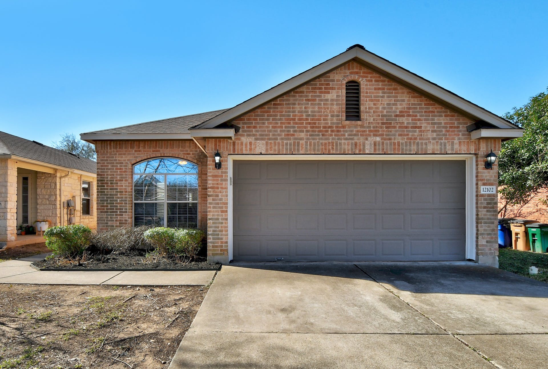 Single-story brick home exterior in Olympic Heights, Austin TX 78748