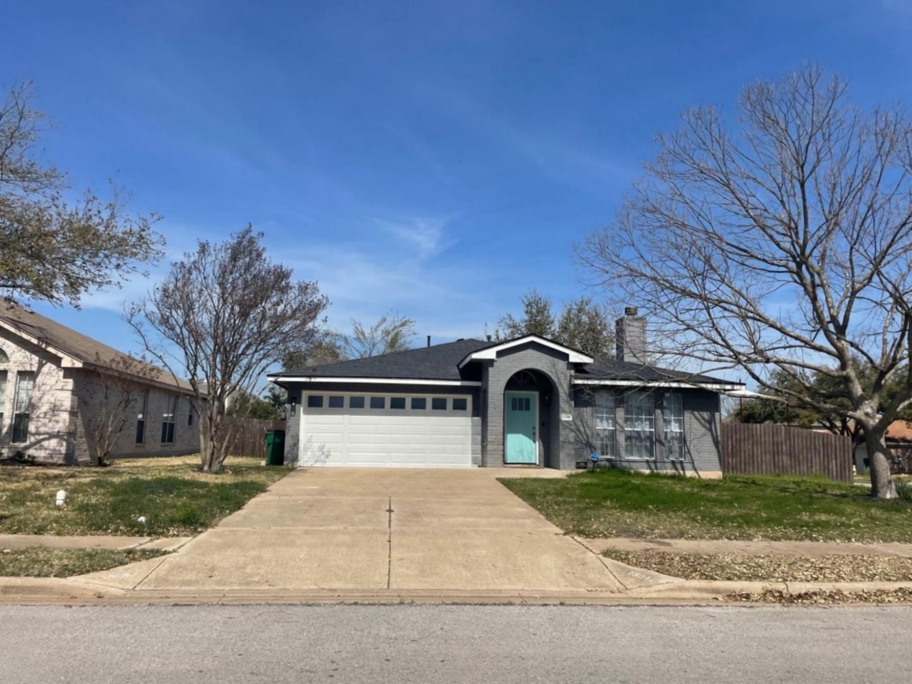 bohls place one story home teal door Pflugerville 78660