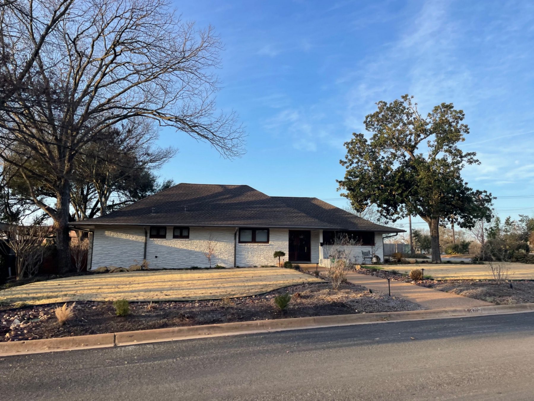 highland park west one story stone home in 78731