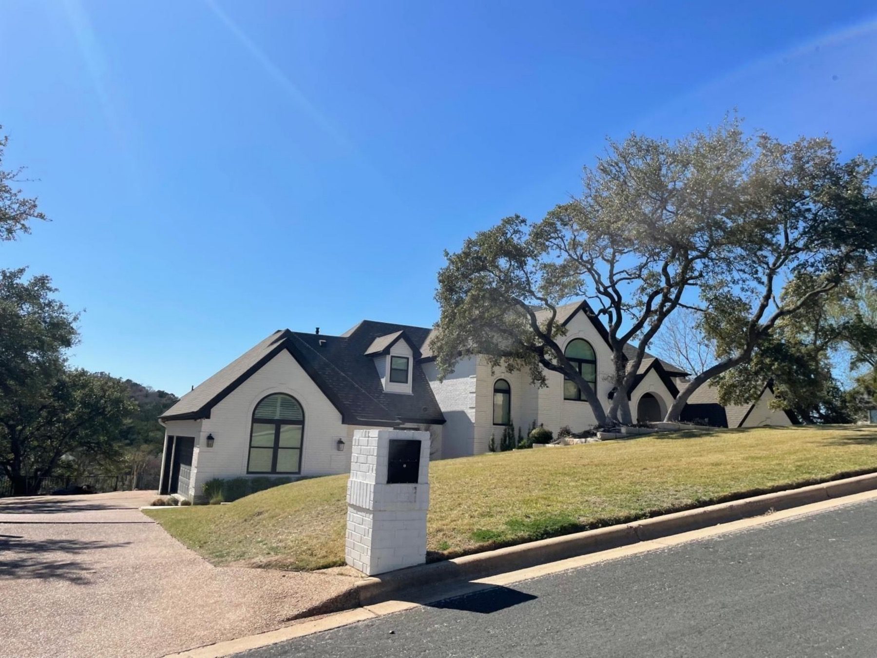 tierra madrones remodeled white brick home in Austin texas 78746