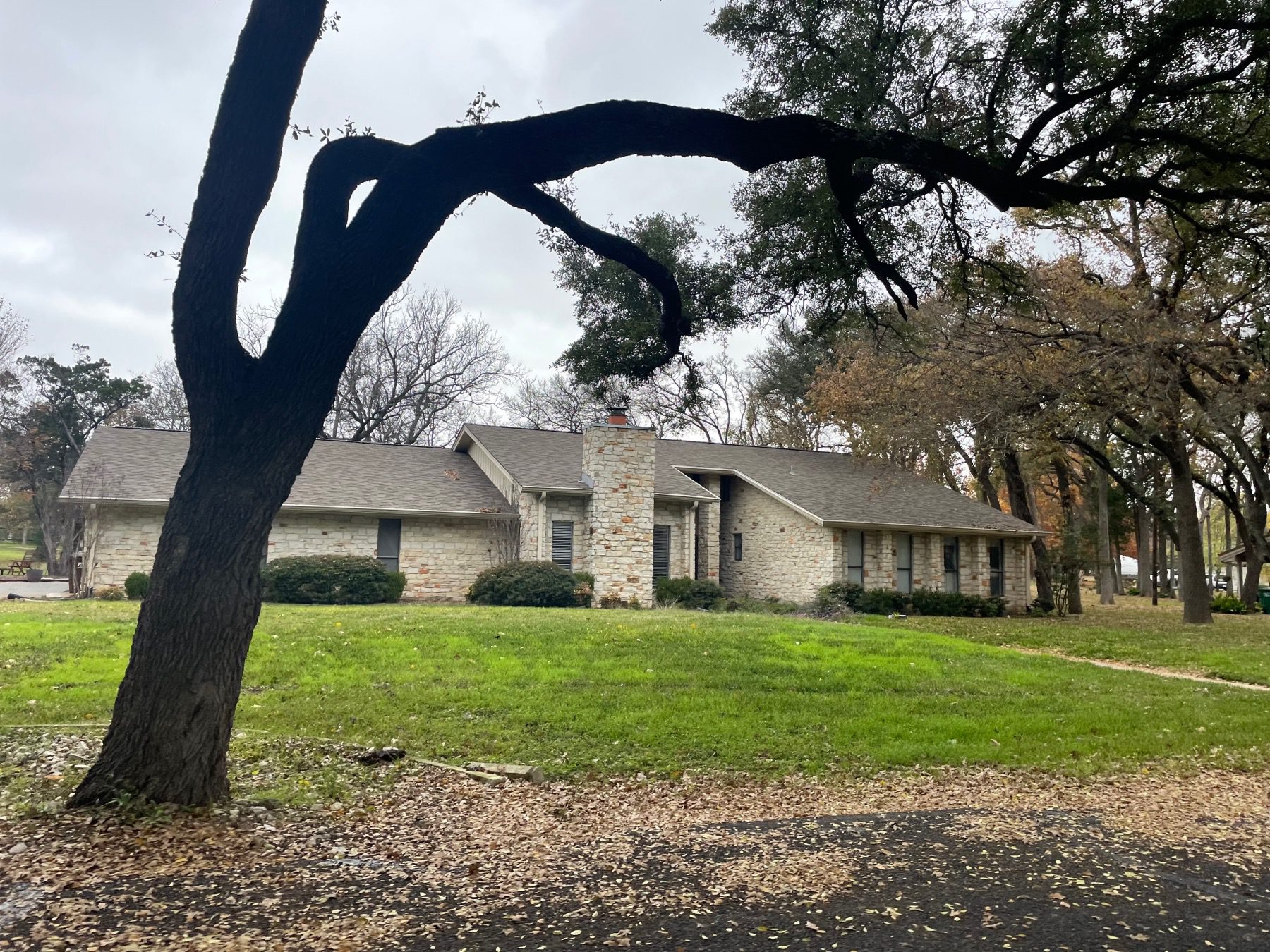 tonkawa springs home with mature trees round rock