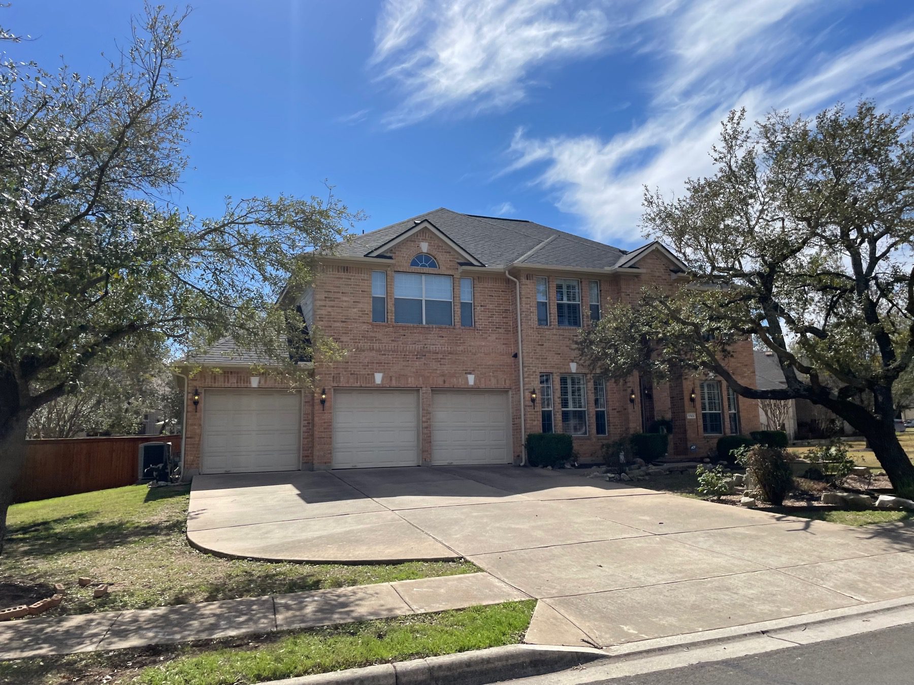 travis country west 2 story red brick home Austin tx 78735