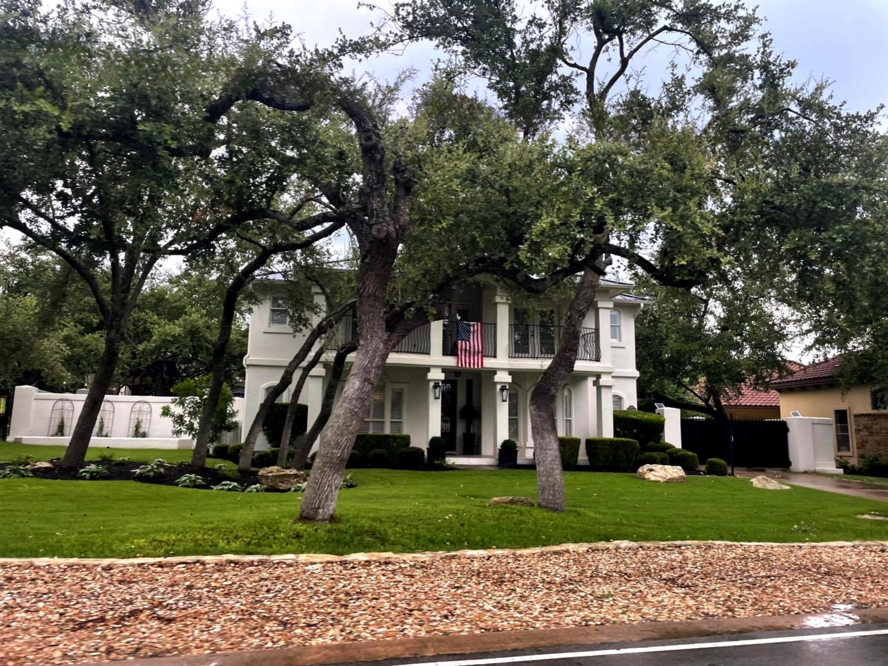 estates above hurst harbor lakeway white stucco home
