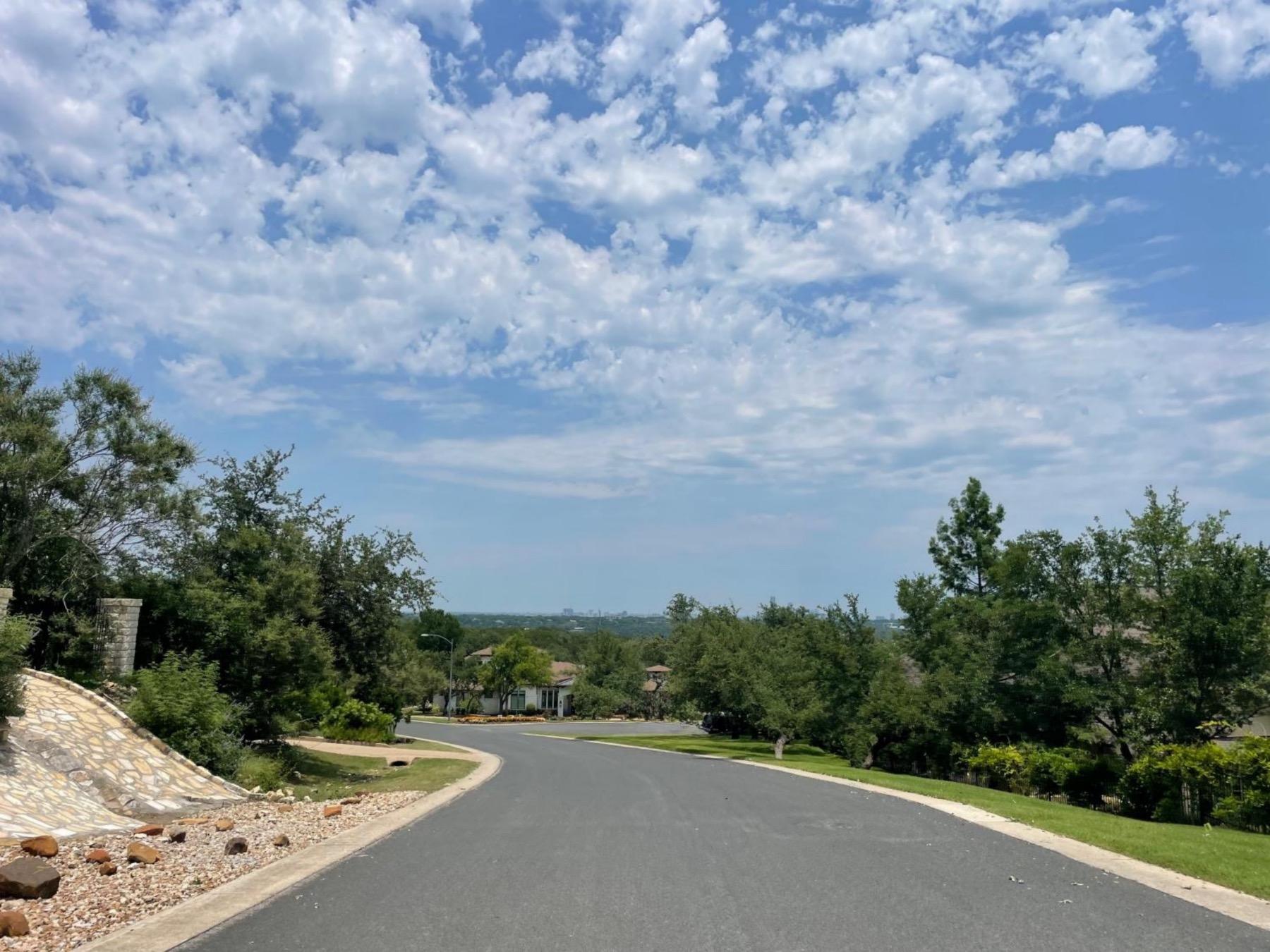 gaines ranch Austin tx 78735 neighborhood street with downtown view