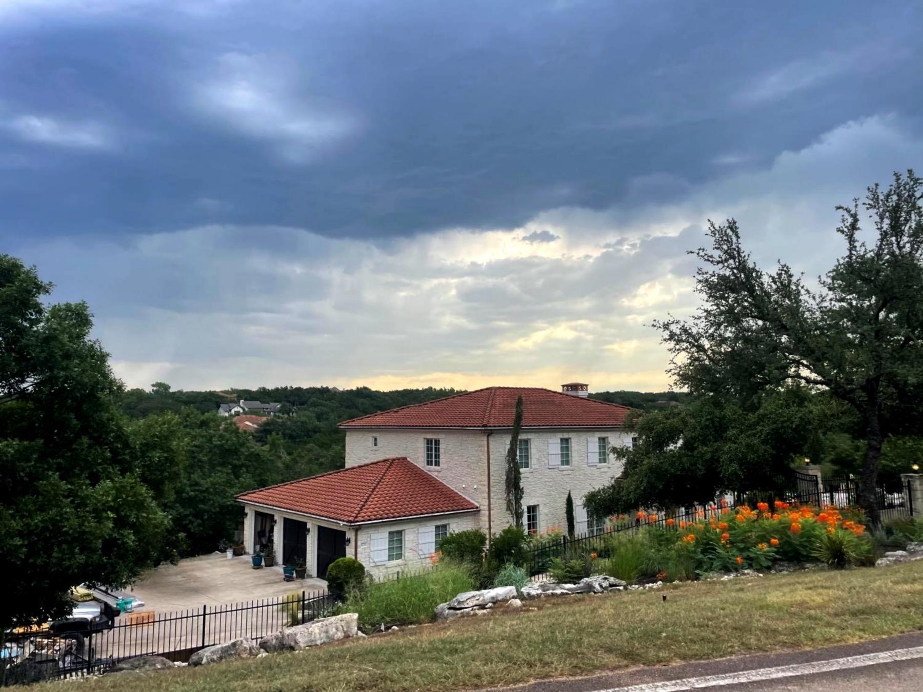 round mountain lakeway home with tile roof