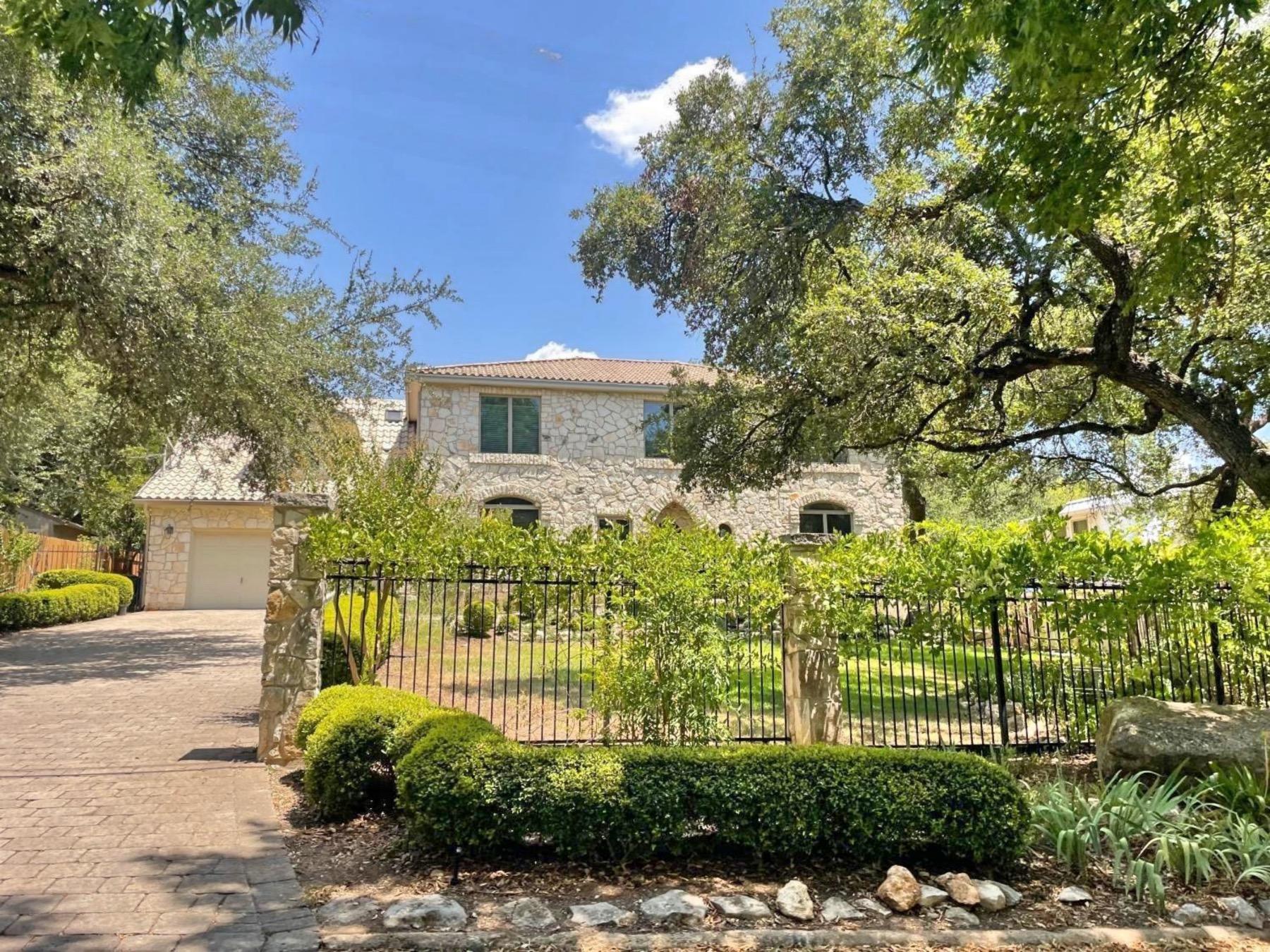 aqua verde two story stone home in Austin tx