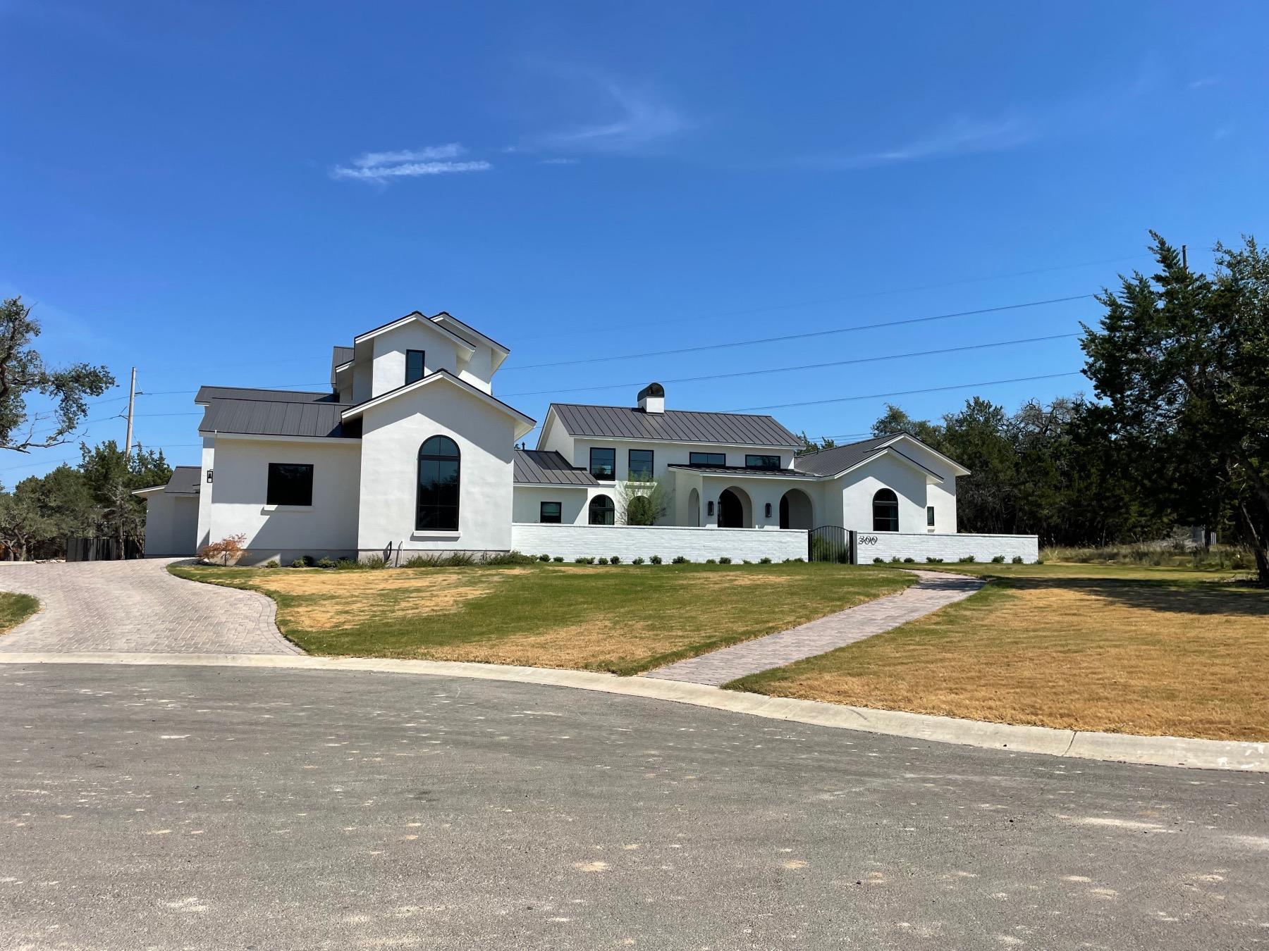 wildwood at caliterra luxury one story white home dripping springs texas
