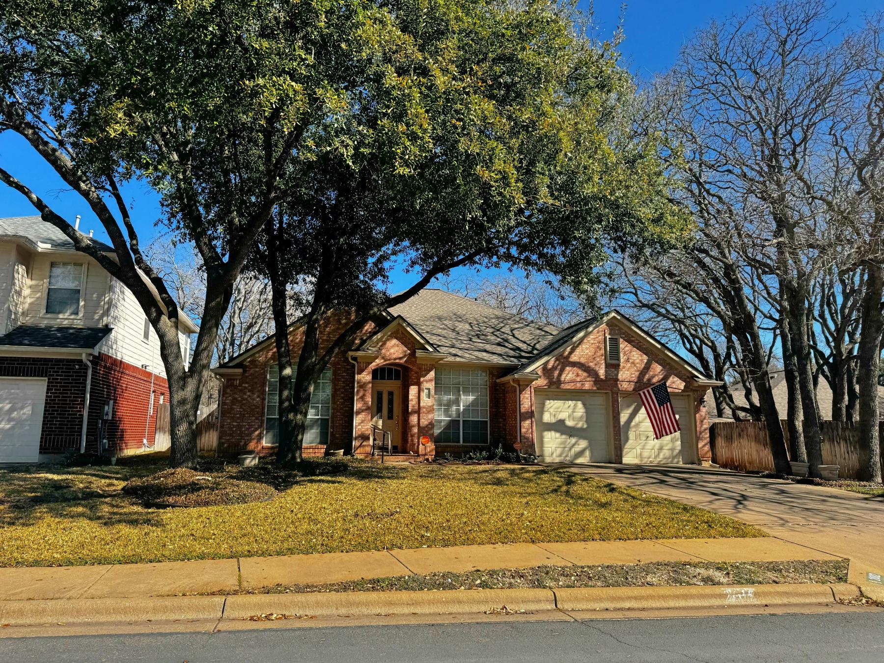 bent tree one story red brick home round rock
