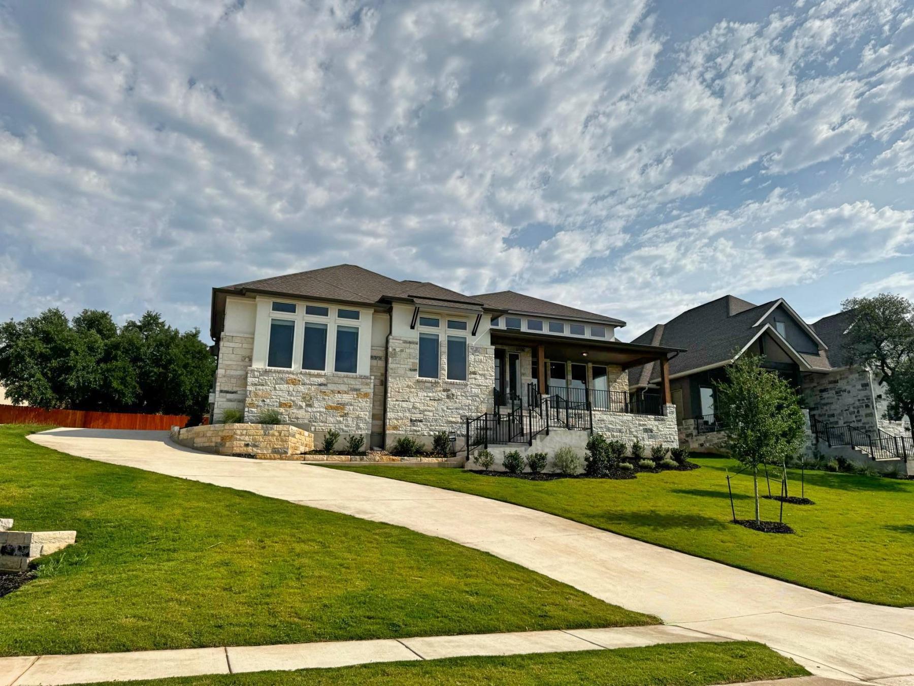 stone stucco home lakeside at tessera lago vista tx