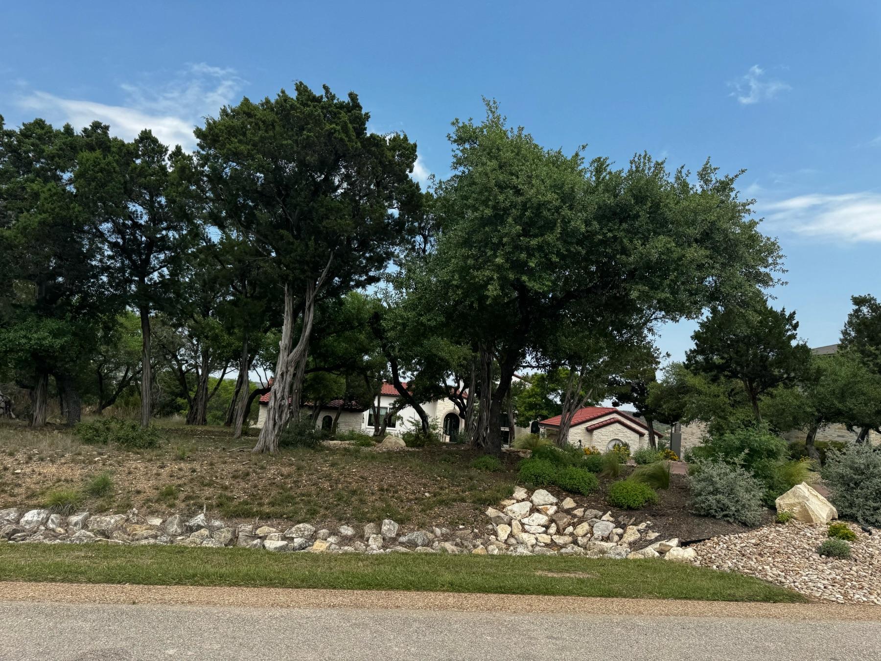luxury home sat back from street reserve lake travis spicewood